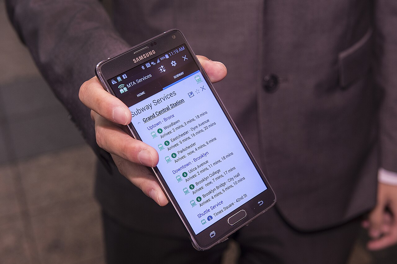 Transit Wireless personnel demonstrate a beacon-enabled version of MTA Subway Time at event to challenge app developers to build apps than can help transit riders -- particularly the disabled -- bette